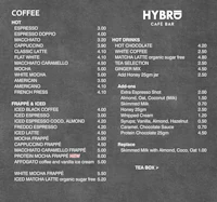 the menu for a coffee shop is shown on a chalkboard