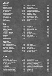 a black and white menu with prices on it