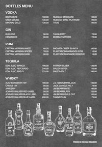 a chalkboard menu with bottles of liquor on it