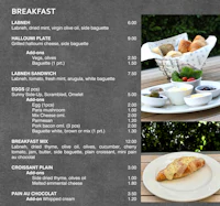 a menu for breakfast is shown on a table